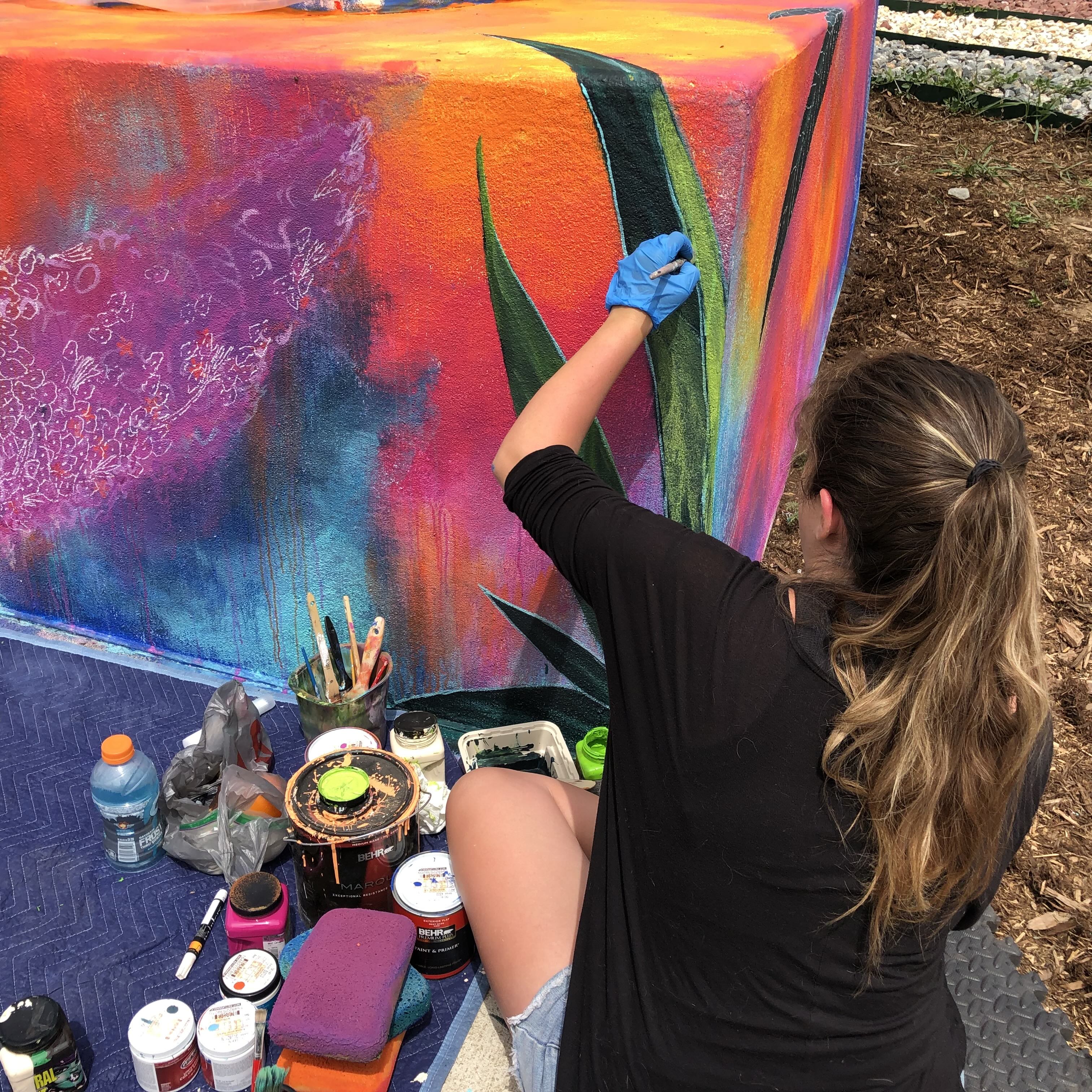 Jennie drawing a mural